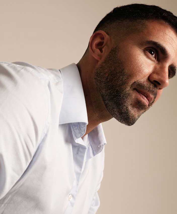 NYC male enhancement model in a white shirt