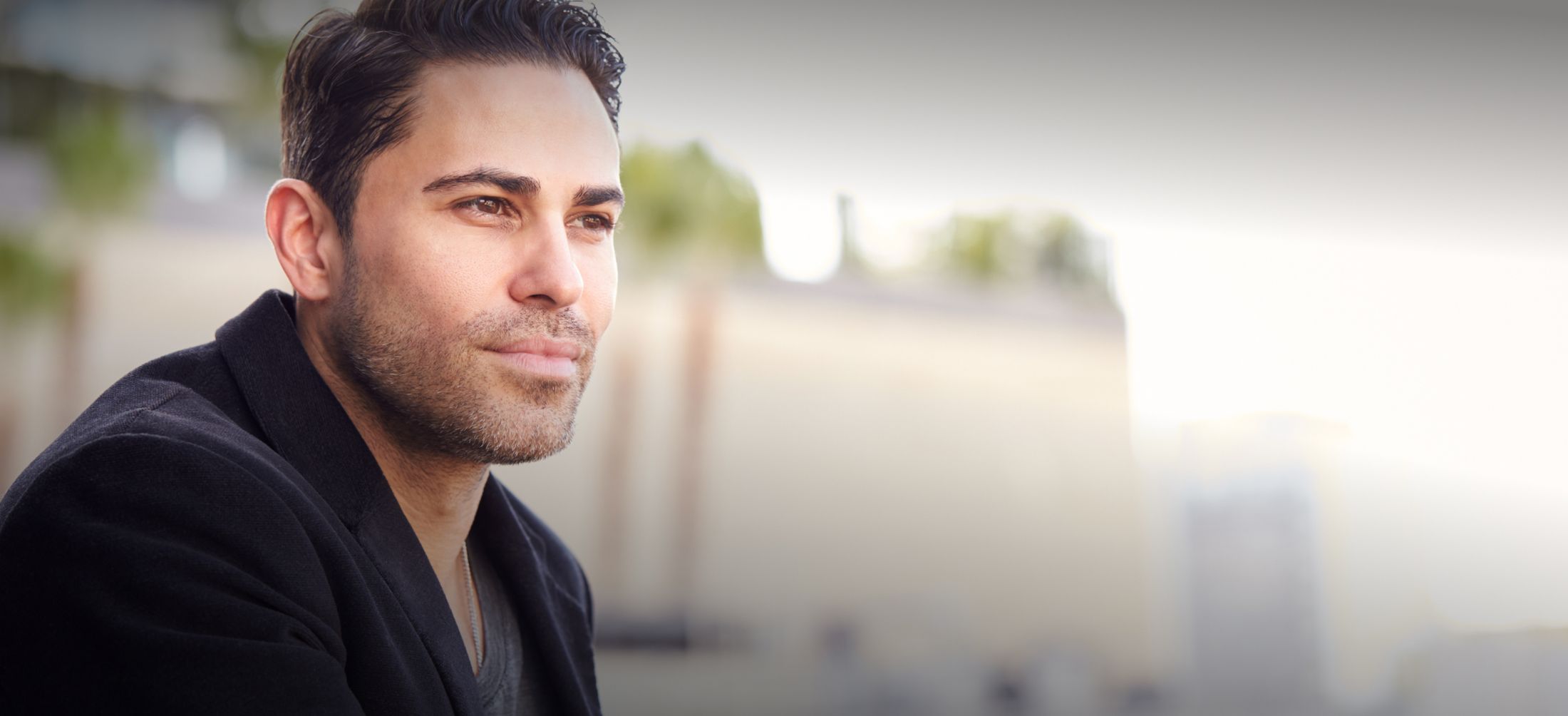 New York City male enhancement model in a black jacket